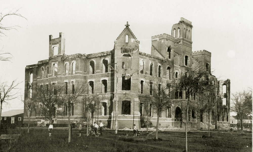 The charred remains of a four-story stone building, Ӱɴý's Waco campus main building after a fire