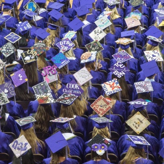 Overhead view of Ӱɴý nursing graduates' decorated caps at Commencement