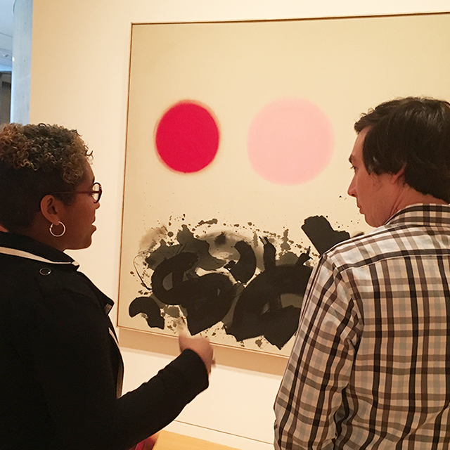 Two Ӱɴý students view a painting at Fort Worth's Modern art museum